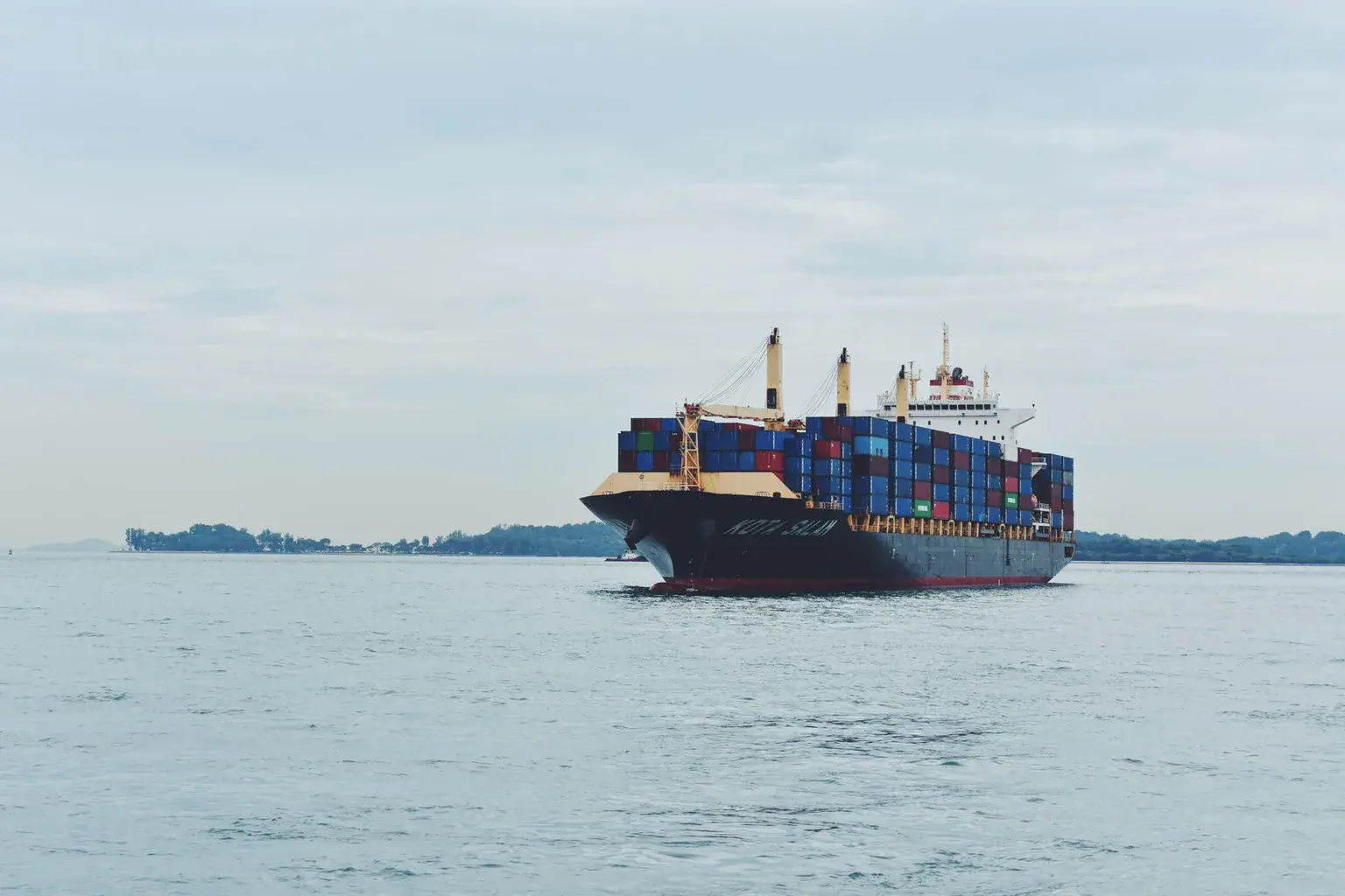 Cargo ship sailing across the sea